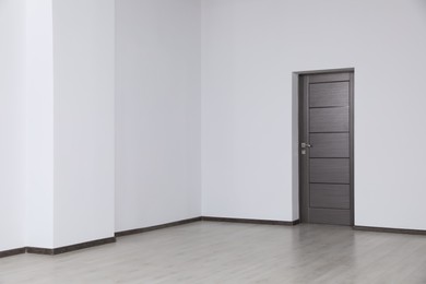 Empty office with dark wooden door. Interior design