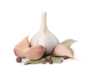 Photo of Fresh garlic bulb and cloves with seasonings isolated on white. Organic food