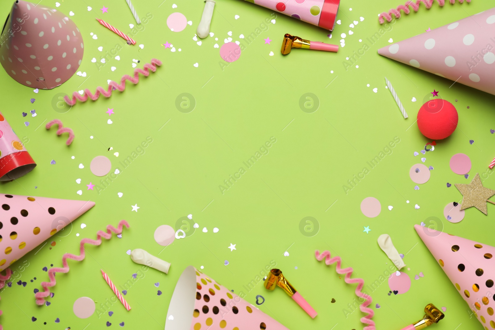 Photo of Frame of party items on light green background, flat lay. Space for text