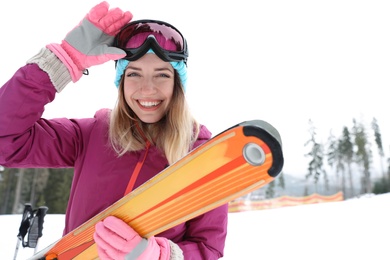 Photo of Female skier on slope at resort. Winter vacation