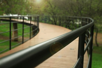 Photo of Beautiful pathway handrails in park near trees