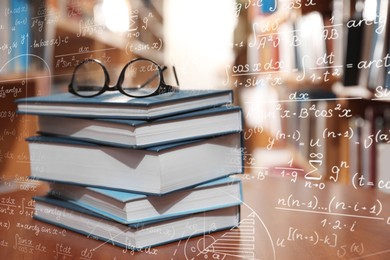 Image of Science and education concept. Illustration of basic physics and mathematics formulas and stack of books with glasses on table in library