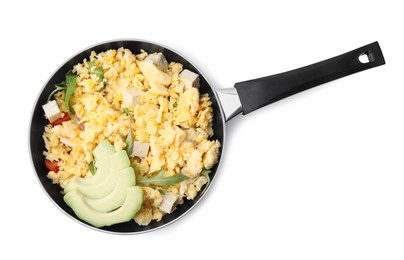 Frying pan with delicious scrambled eggs, tofu and avocado isolated on white, top view