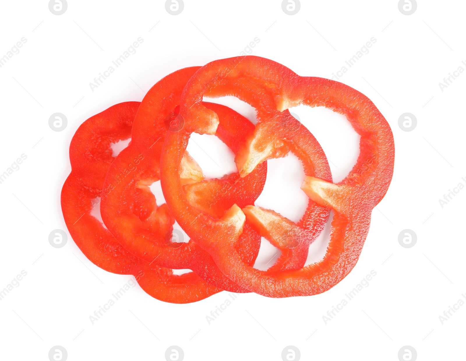 Photo of Slices of ripe red bell pepper isolated on white, top view