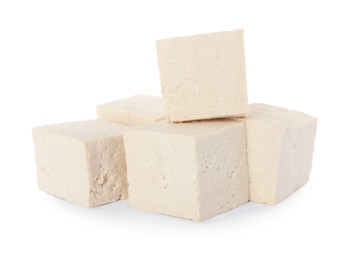 Photo of Cubes of delicious raw tofu on white background