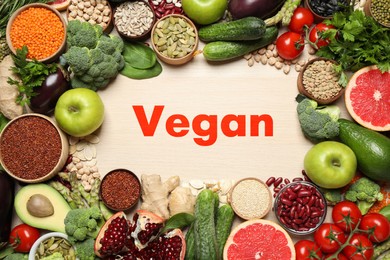 Image of Word Vegan and fresh products on wooden background, flat lay