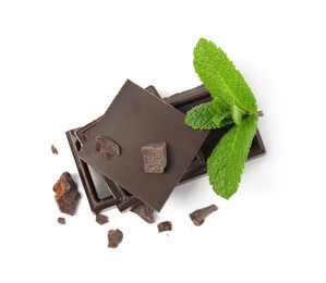 Photo of Tasty dark chocolate pieces with mint on white background, top view