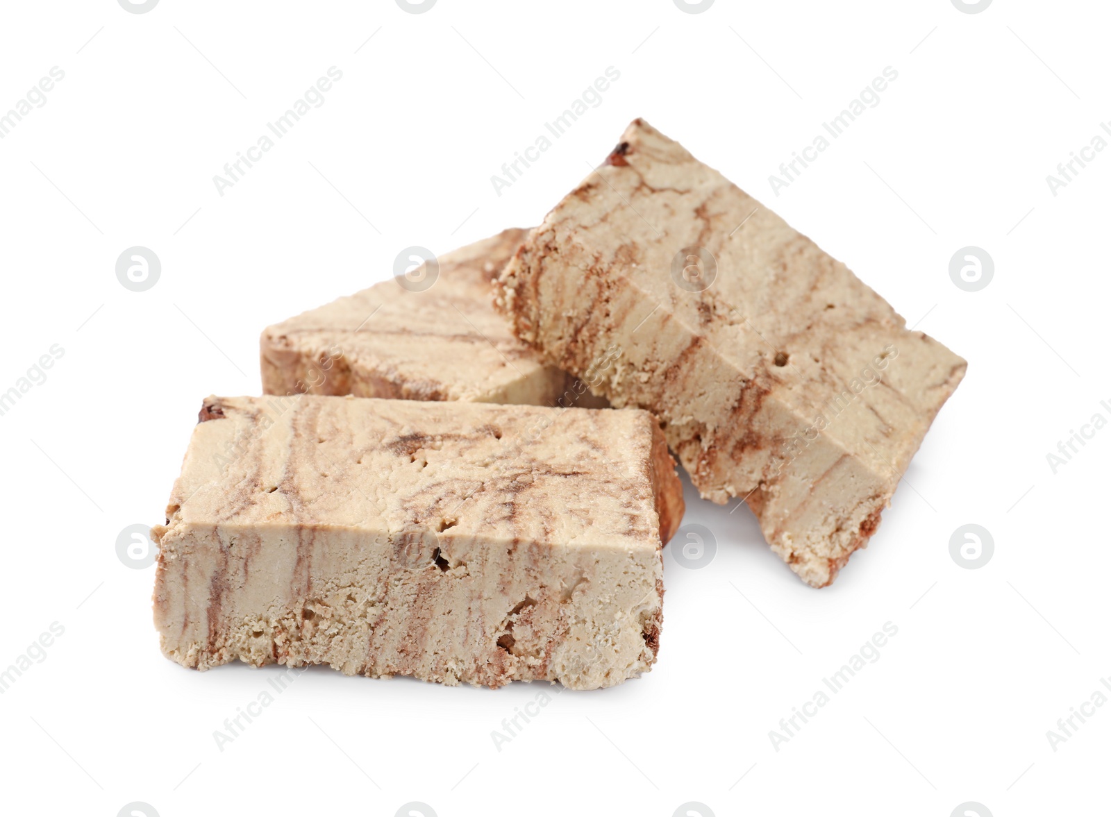 Photo of Pieces of tasty chocolate halva isolated on white