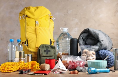 Photo of Disaster supply kit for earthquake on wooden table