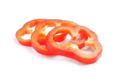 Photo of Slices of ripe red bell pepper on white background