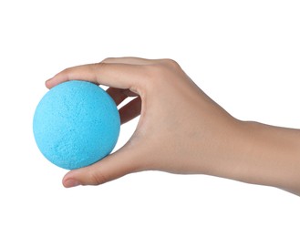 Photo of Woman holding light blue bath bomb on white background, closeup