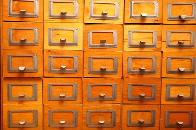 Library card catalog drawers as background, closeup