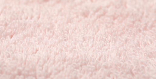 Texture of soft light pink fabric as background, closeup