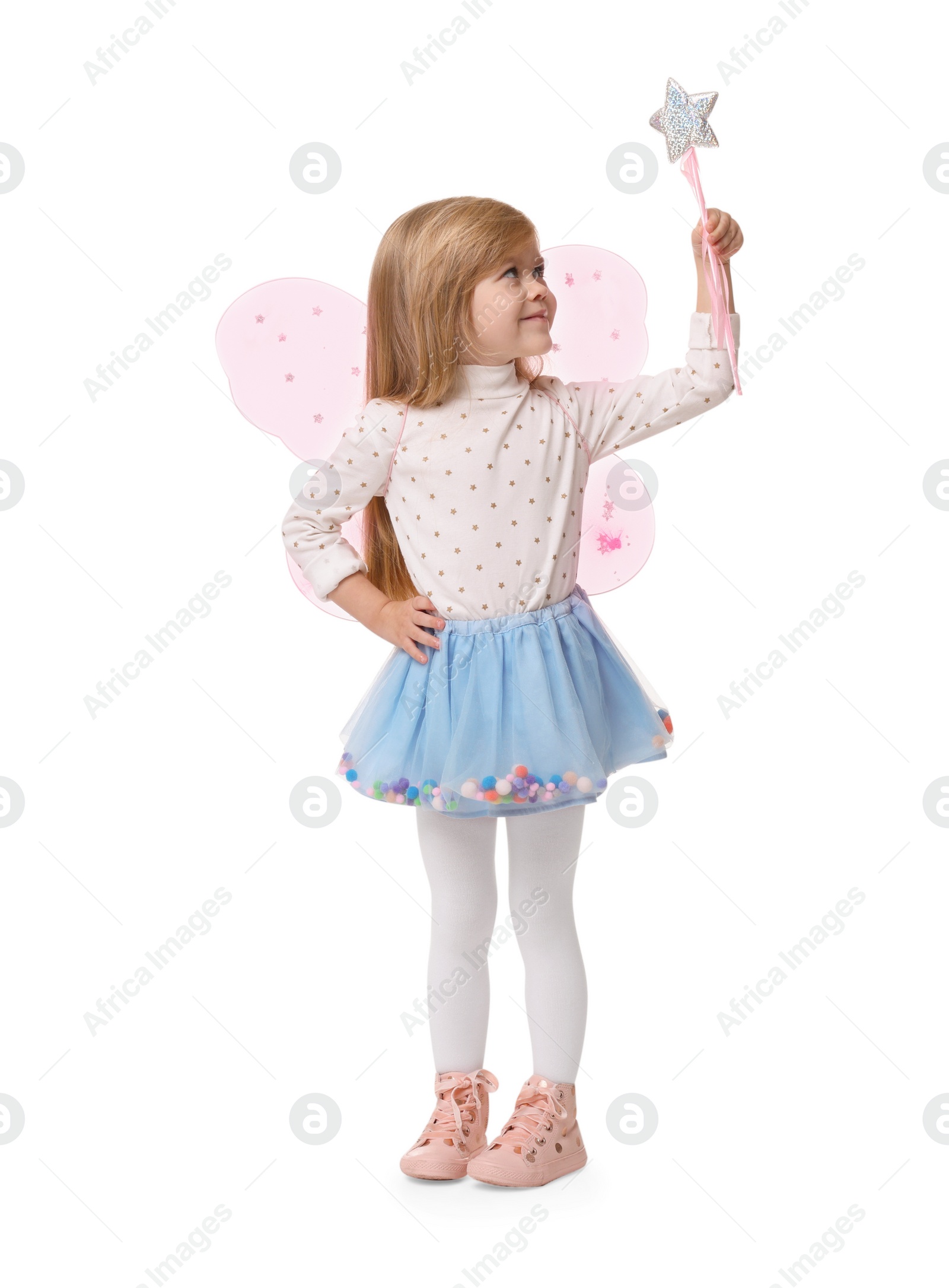 Photo of Cute little girl in fairy costume with pink wings and magic wand on white background