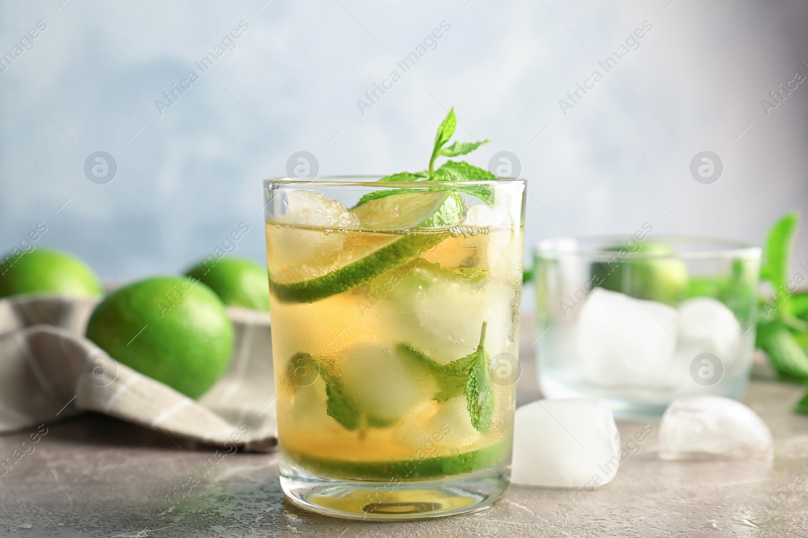 Photo of Composition with delicious mint julep cocktail on table