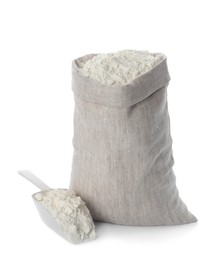 Photo of Sack and scoop with flour on white background