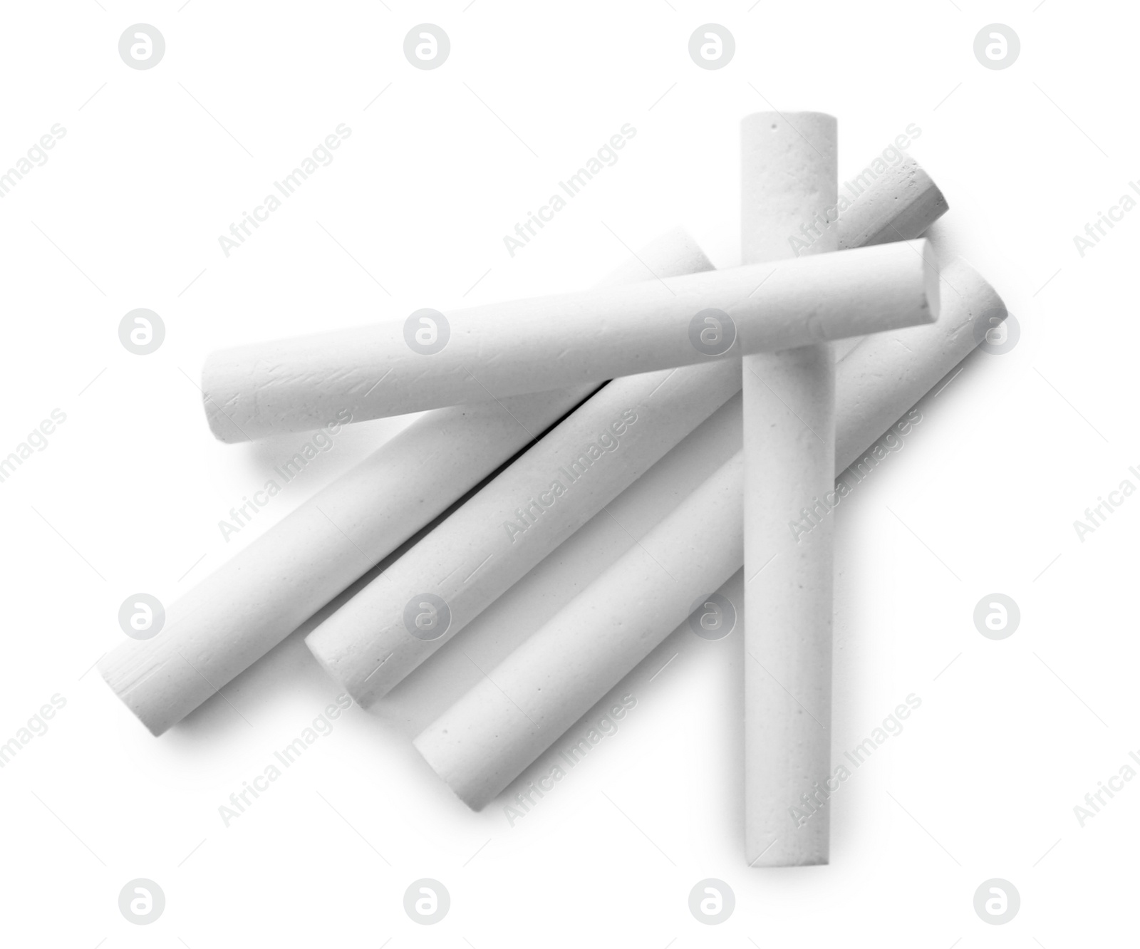 Photo of Pieces of chalk on white background