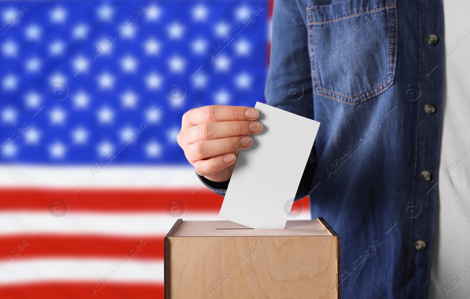 Image of Election in USA. Woman putting her vote into ballot box against national flag of United States, closeup. Banner design