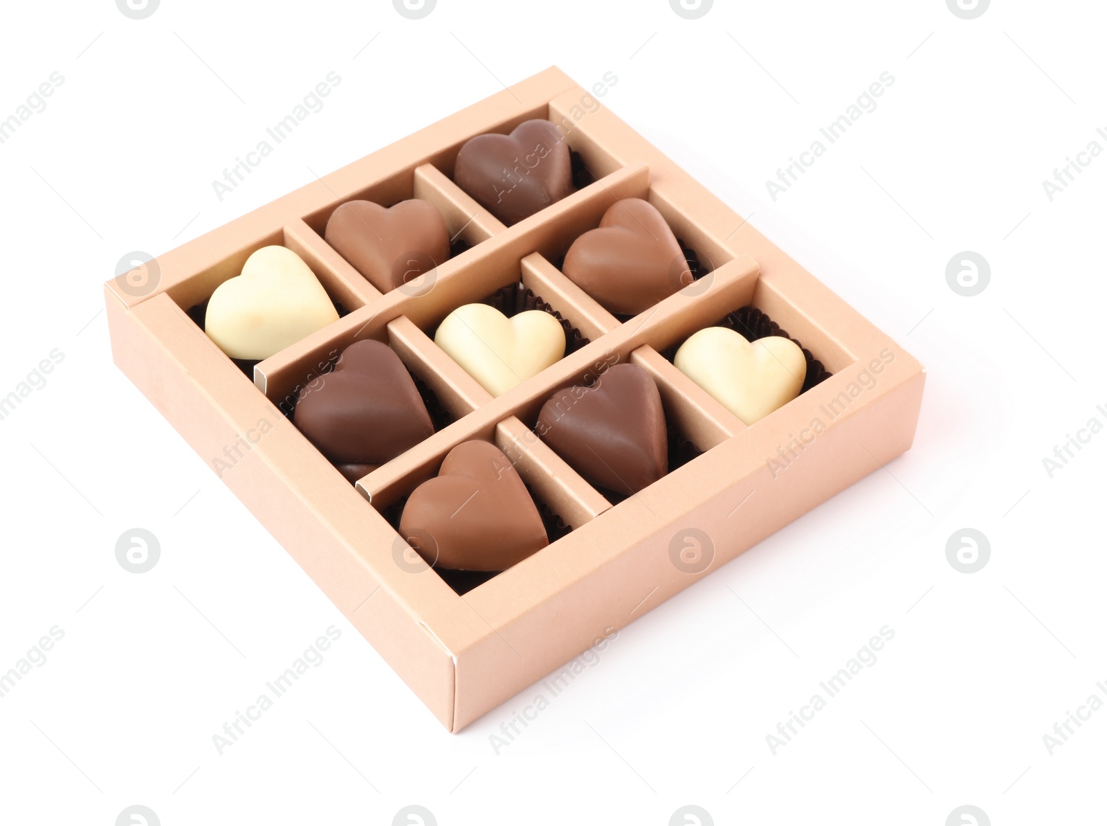 Photo of Delicious heart shaped chocolate candies in box isolated on white