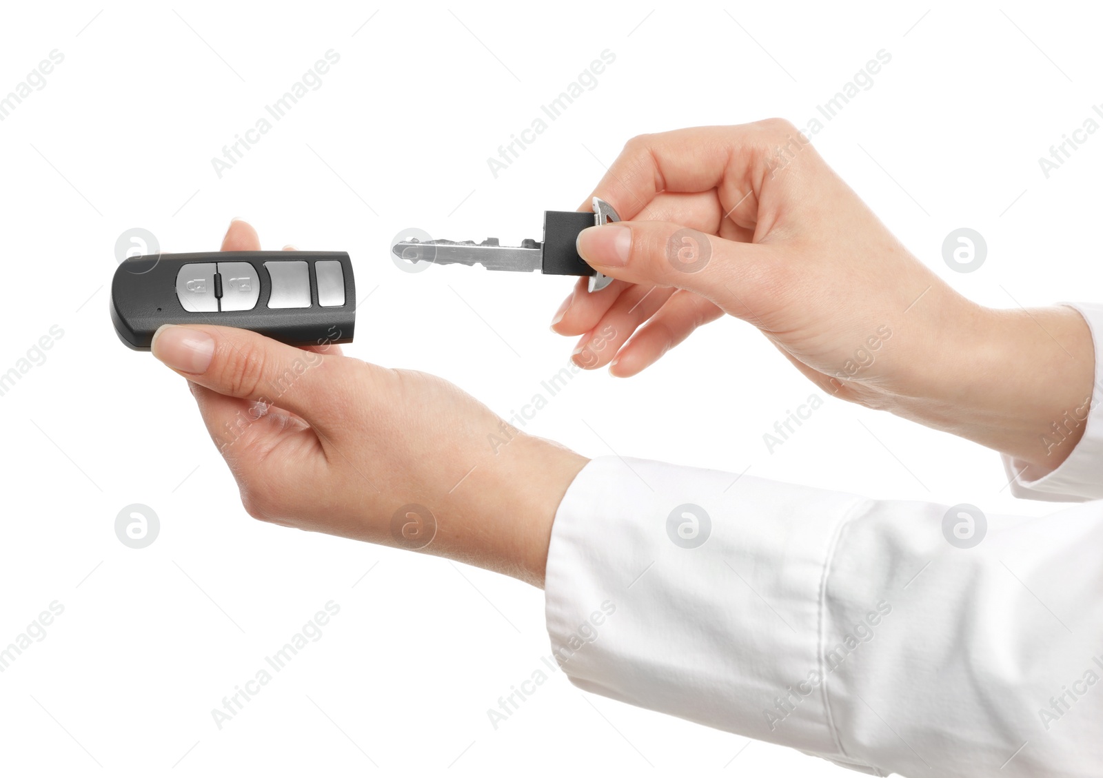 Photo of Woman holding car key with alarm system remote control isolated on white