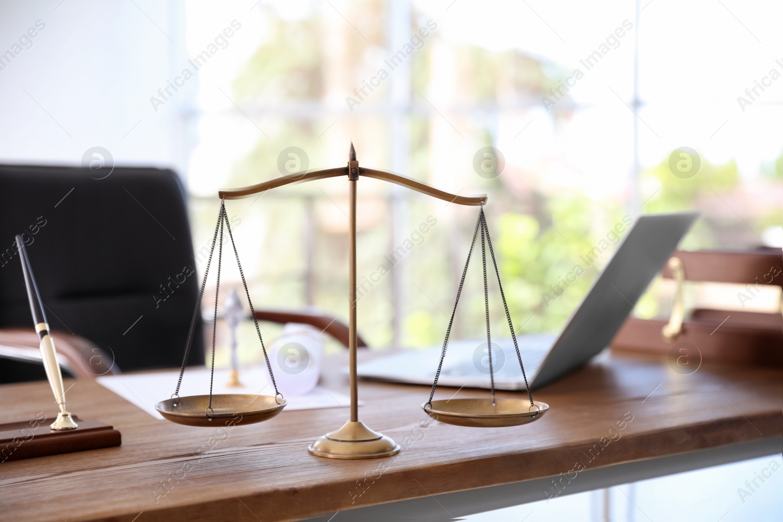 Photo of Scales of justice on desk in notary's office