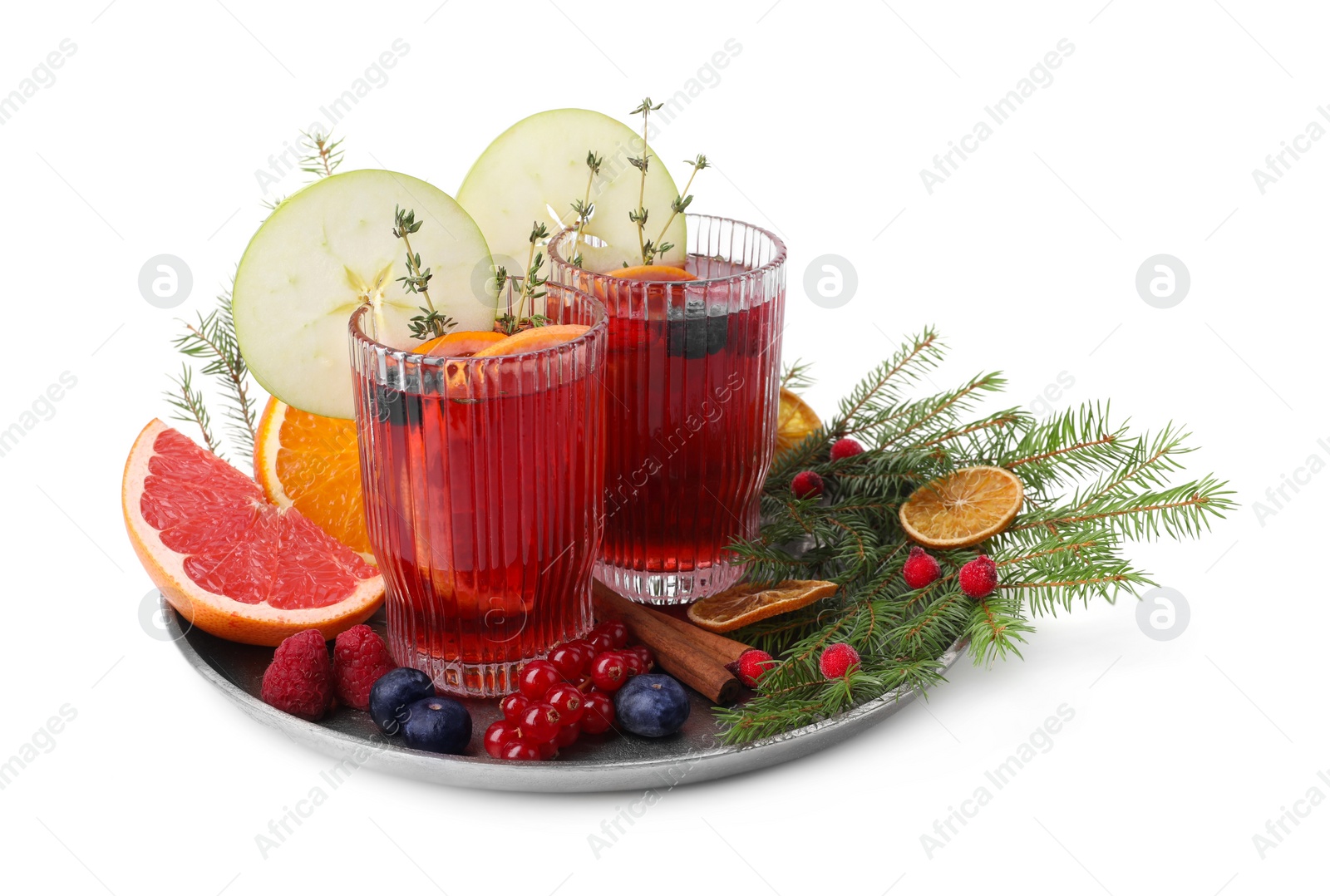 Photo of Composition with aromatic Christmas Sangria in glasses isolated on white