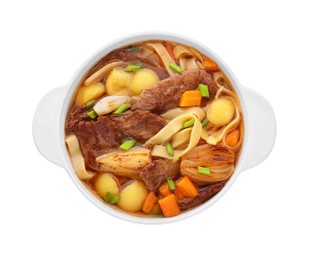 Photo of Pot of delicious vegetable soup with meat, noodles and ingredients isolated on white, top view