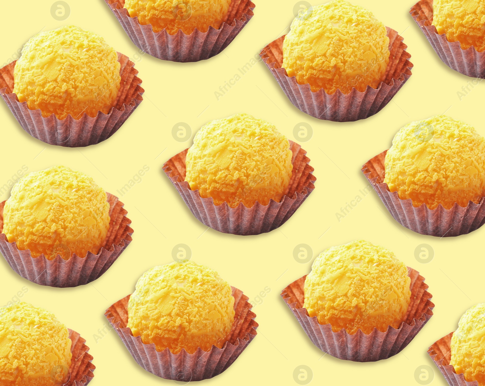 Image of Tasty candies on pale yellow background. Pattern design