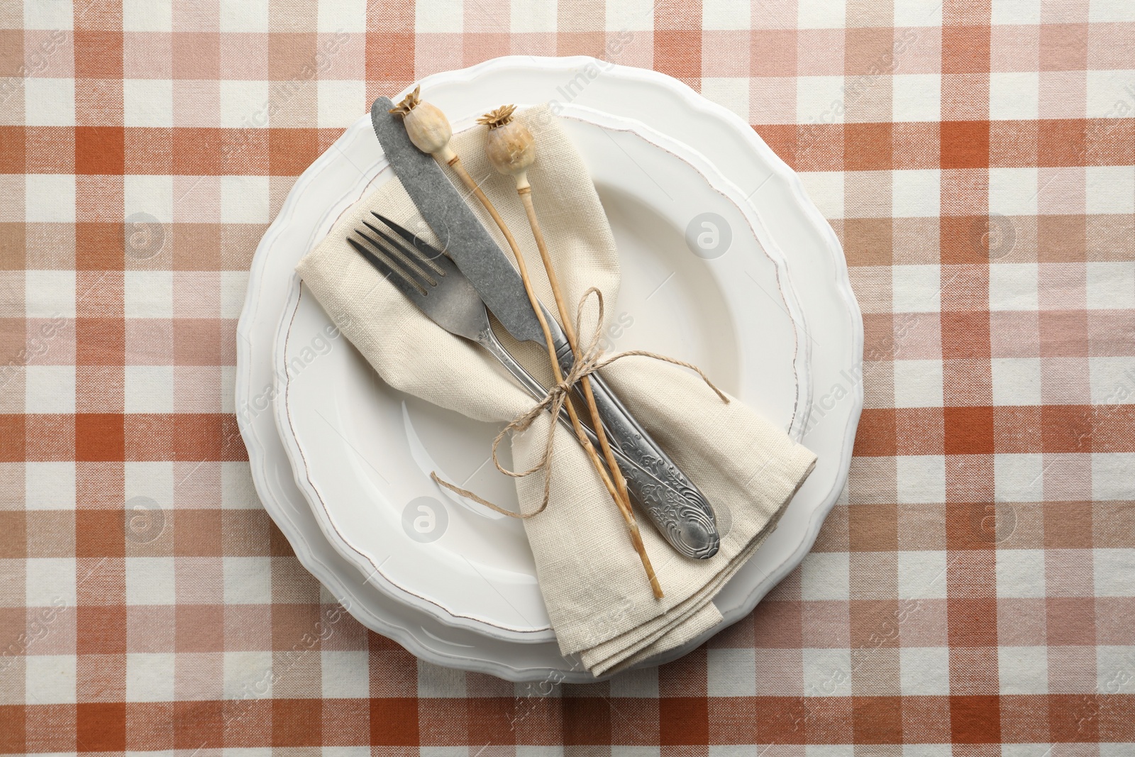 Photo of Stylish setting with cutlery and plates on table, top view