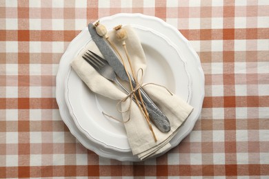 Stylish setting with cutlery and plates on table, top view