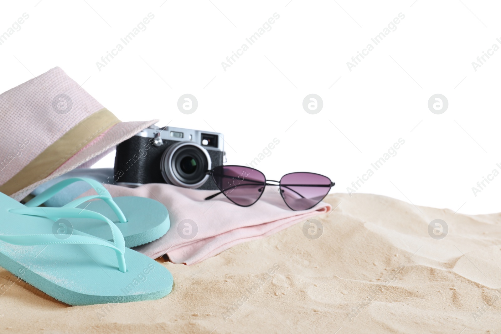 Photo of Composition with beach objects on sand against white background. Space for text