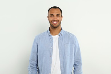 Photo of Portrait of handsome young man on white background