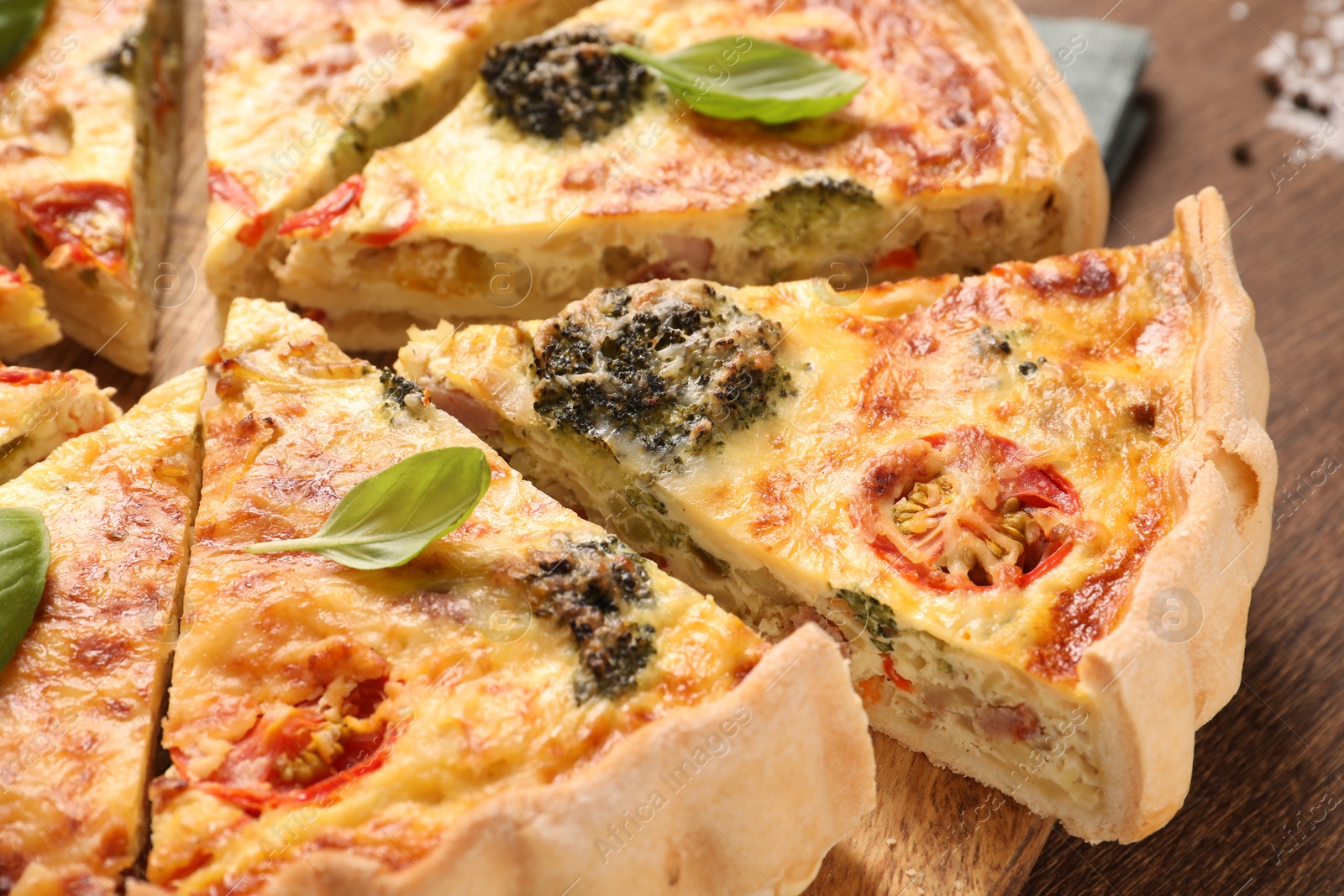 Photo of Delicious homemade vegetable quiche on table, closeup