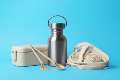 Composition with eco friendly products on light blue background. Conscious consumption