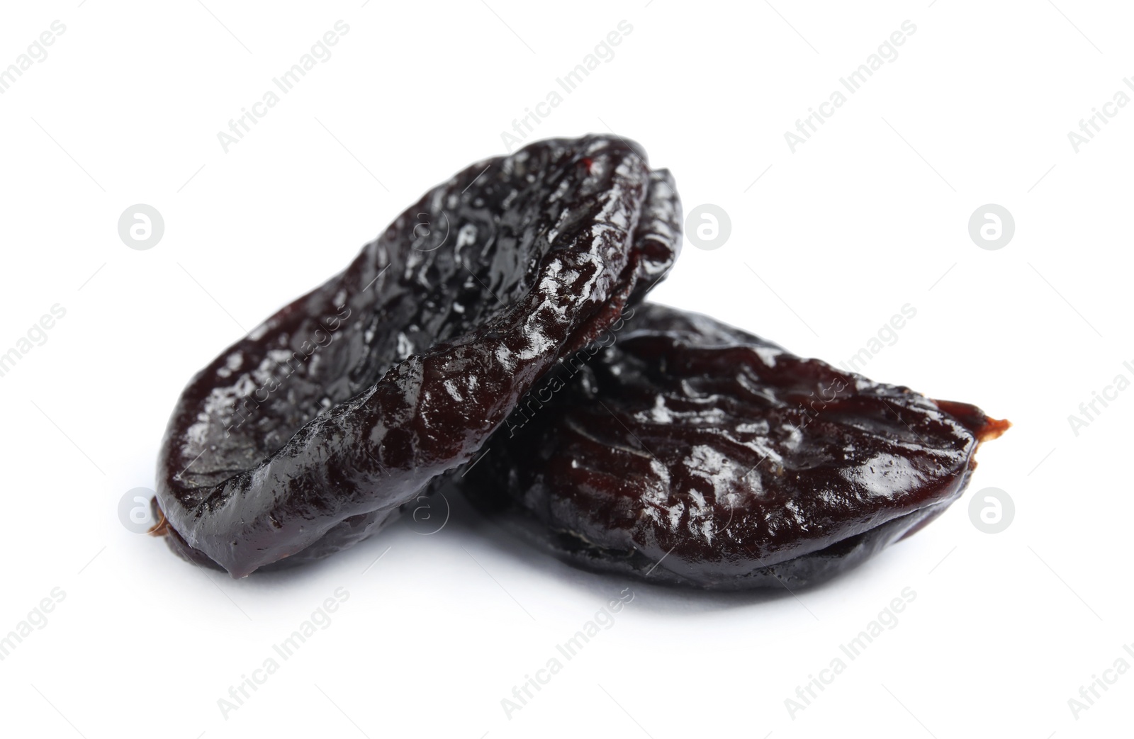 Photo of Tasty prunes on white background. Dried fruit as healthy snack