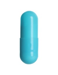 Photo of One light blue pill on white background. Medicinal treatment