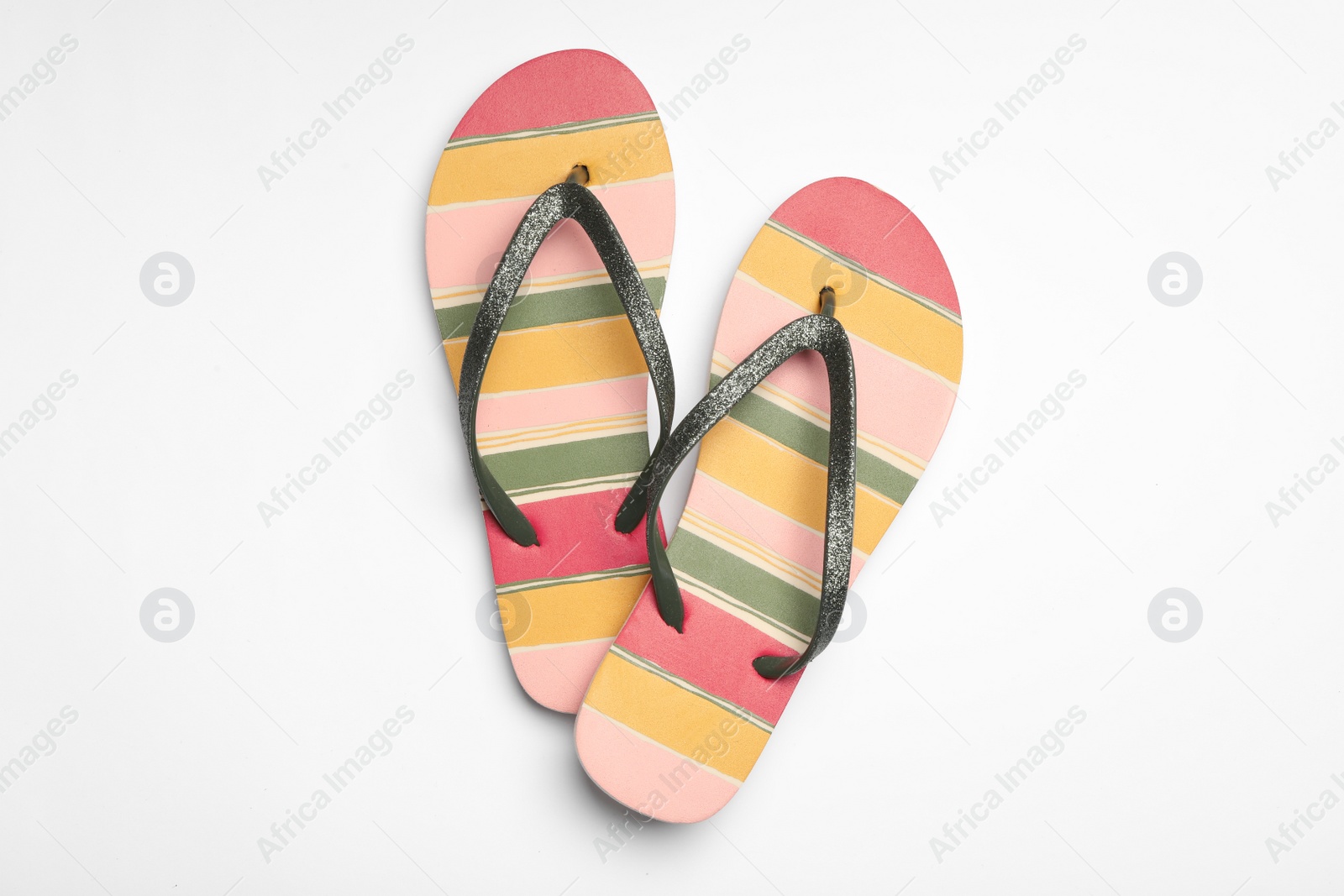 Photo of Pair of flip flops on white background, top view. Beach accessories