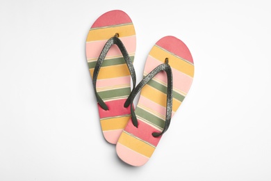 Pair of flip flops on white background, top view. Beach accessories