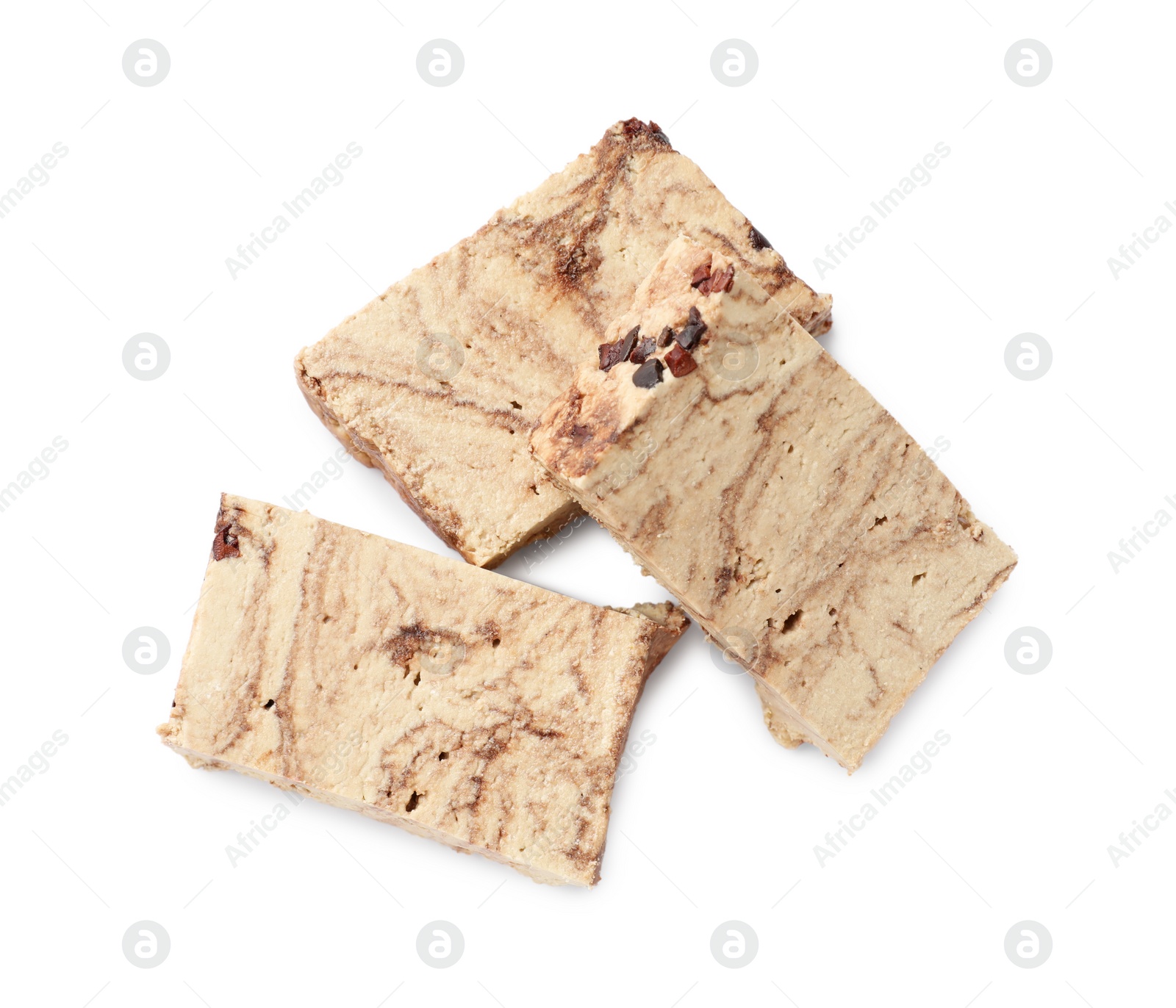 Photo of Pieces of tasty chocolate halva isolated on white, top view