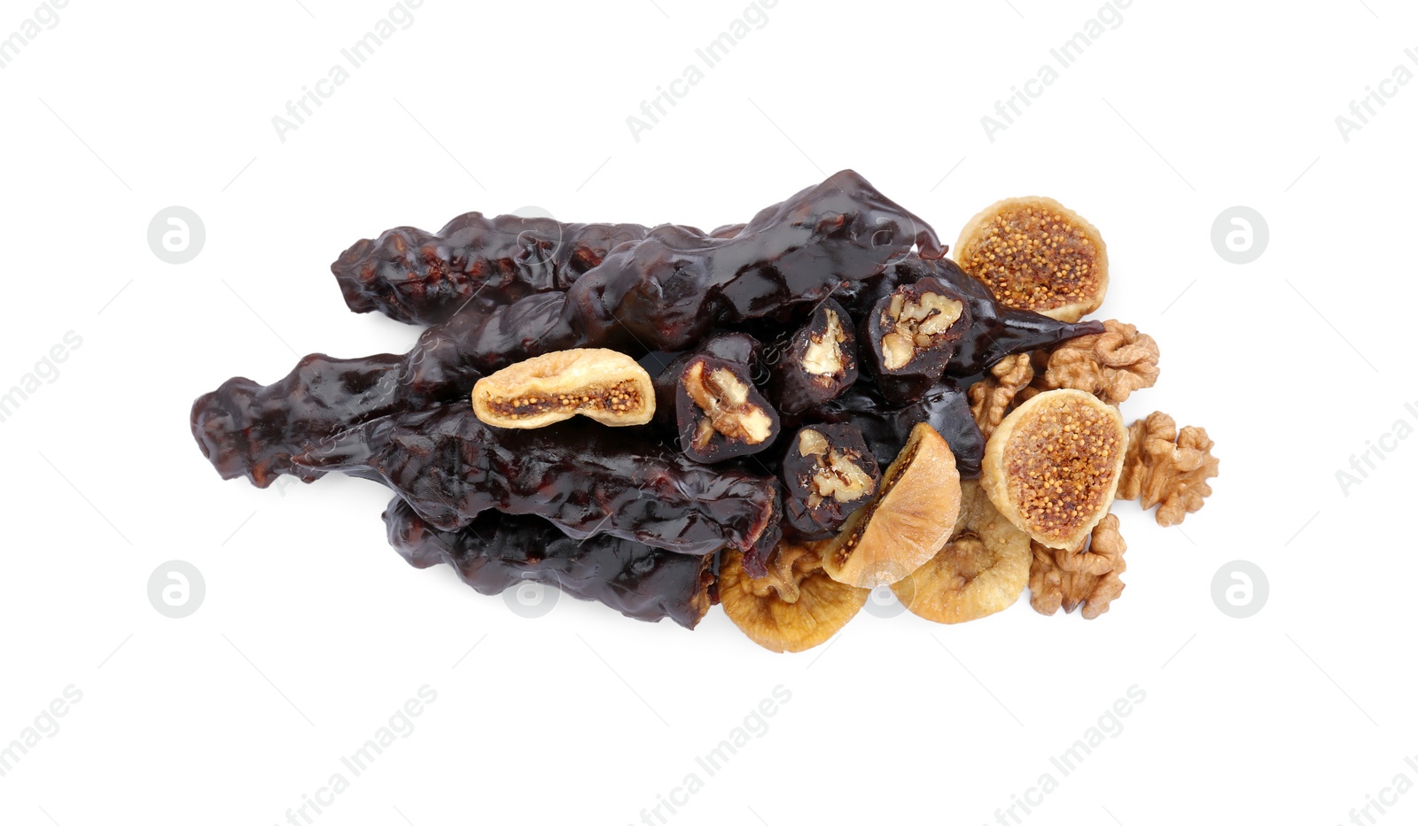 Photo of Delicious sweet churchkhelas with walnuts and dried figs isolated on white, top view