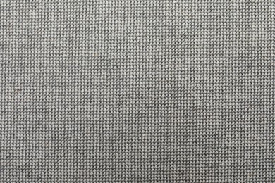 Photo of Texture of grey fabric as background, top view