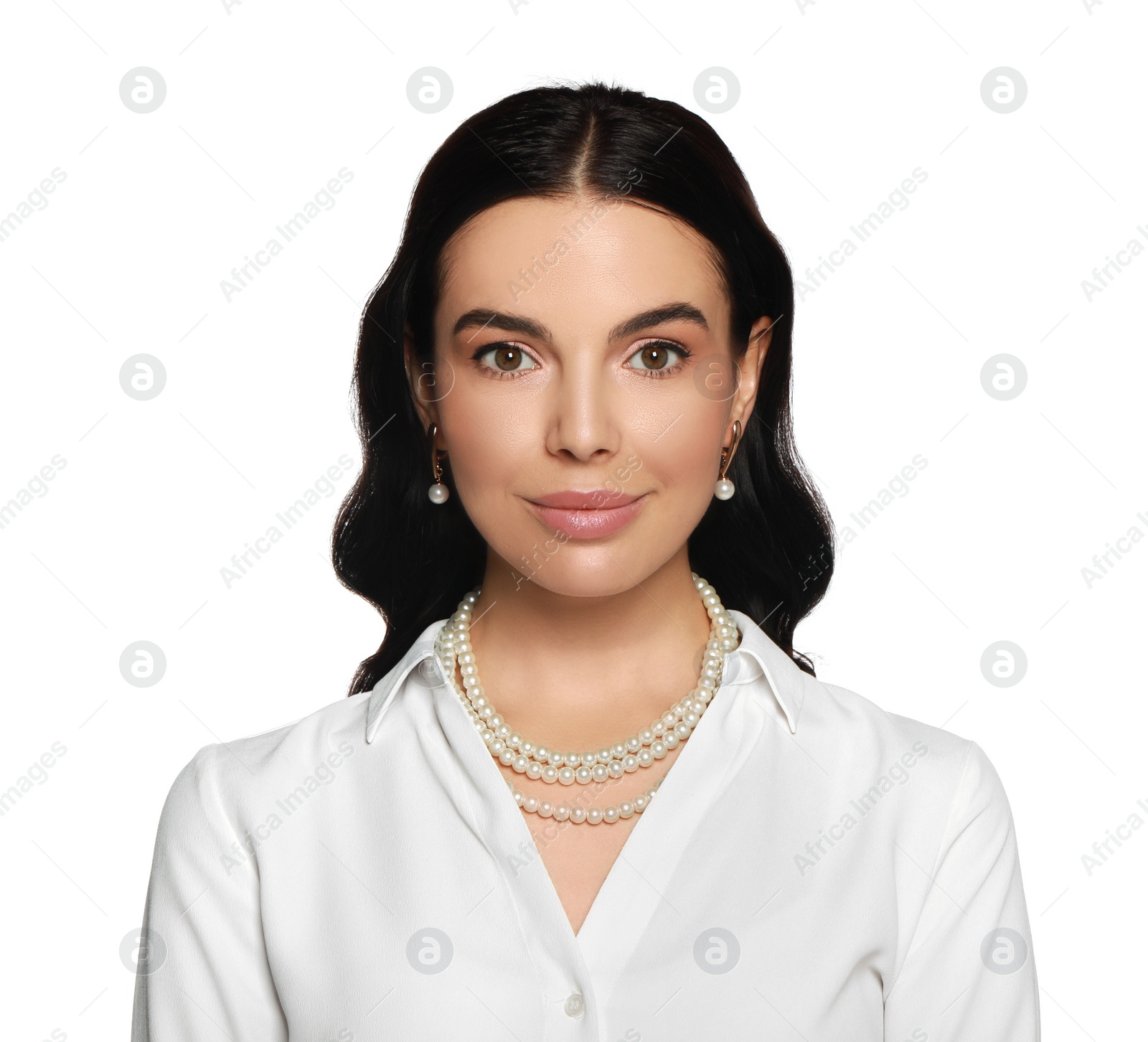 Photo of Young woman wearing elegant pearl jewelry on white background