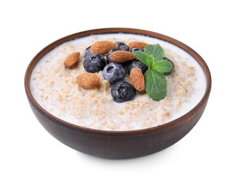 Photo of Tasty wheat porridge with milk, blueberries and almonds in bowl isolated on white