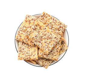 Photo of Delicious crackers in bowl isolated on white, top view