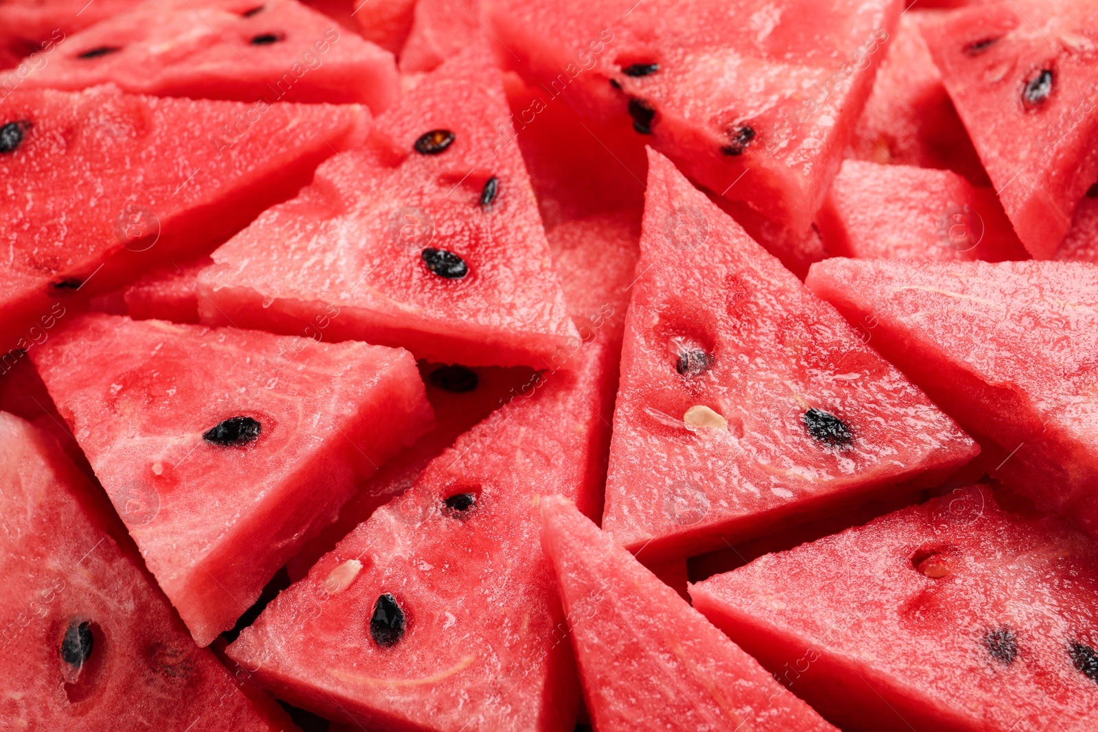 Photo of Delicious fresh watermelon slices as background, closeup