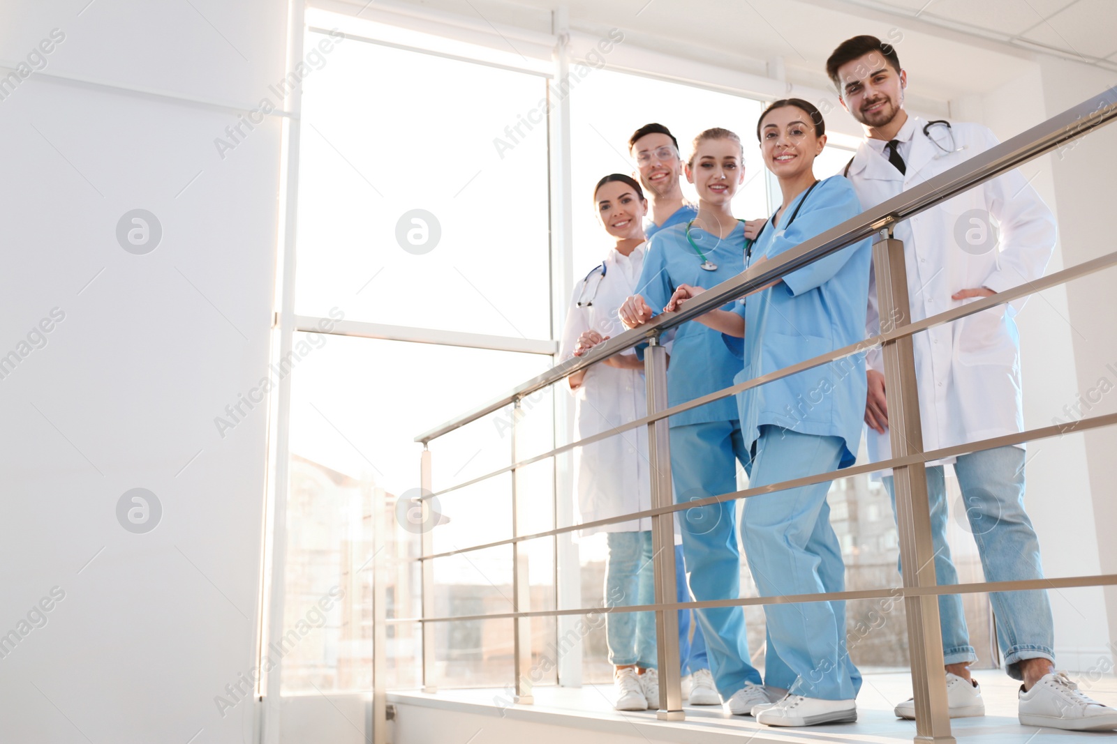 Photo of Group of medical doctors indoors. Unity concept