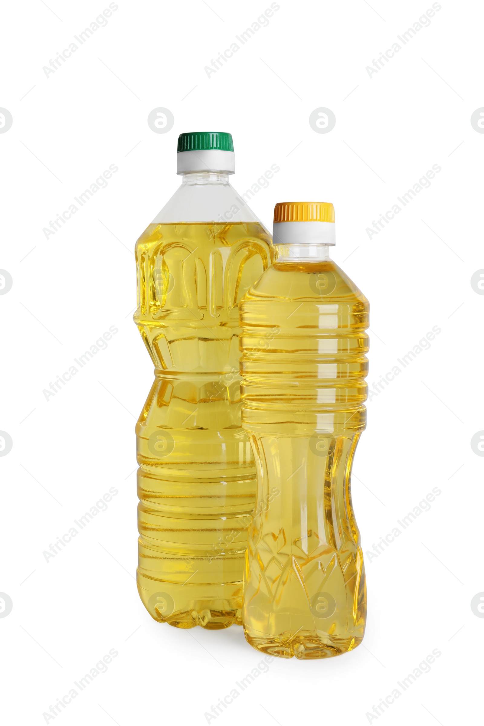 Photo of Bottles of cooking oil on white background