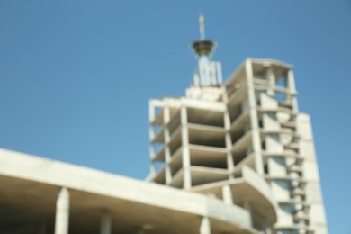 Blurred view of unfinished building against blue sky