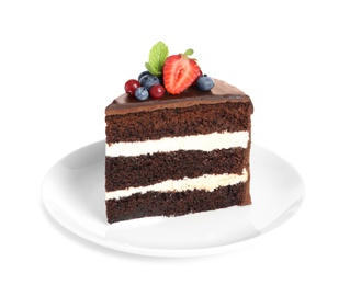 Plate with slice of chocolate sponge berry cake on white background