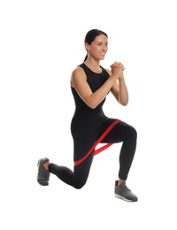 Woman doing lunges with fitness elastic band on white background